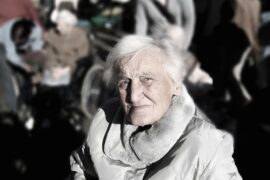 Old lady with alzheimer's in a crowd looking lost