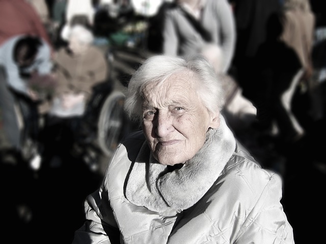 Old lady with alzheimer's in a crowd looking lost