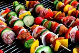 Close up of vegetable and meat skewers on a BBQ grill showing that their are healthy alterantives to grilling