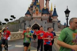 Runners running through Sleeping Beauty's castle at Disneyland Paris