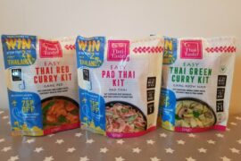 Three packets of Thai Taste mEAL kit pouches lined up on a table.