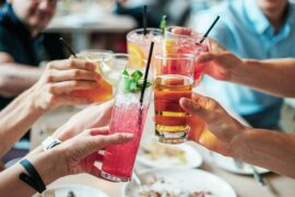 5 drinks being clinked together in cheers