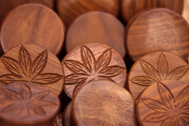 wooden discs with imprint of cannabis leaves on them to indictae the benefits of cbd for health and wellness