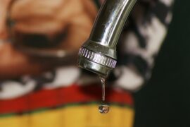 Close up of a leaky tap