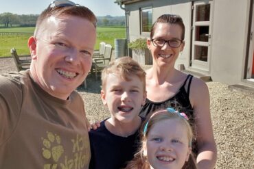 the four members of the Stafferton family smiliing on holiday in Dorset. reflections on how fast the children are growing up.