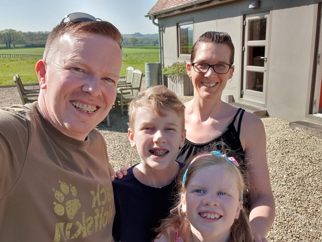 the four members of the Stafferton family smiliing on holiday in Dorset. reflections on how fast the children are growing up.