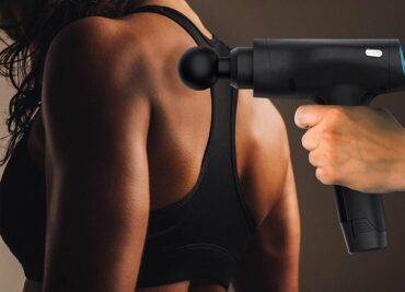 massage guin being used on a female's back