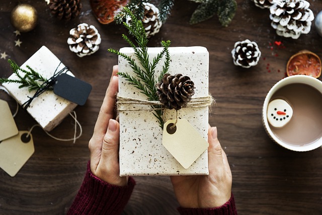a christmas present wrapped in natural recyclable paper as an ideas for sustainable christmas gift ideas