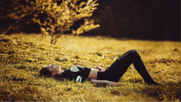 A woman lying on the grass