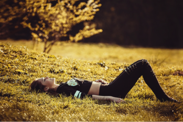 A woman lying on the grass