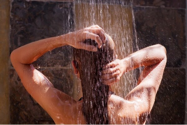 woman washing hair in shower