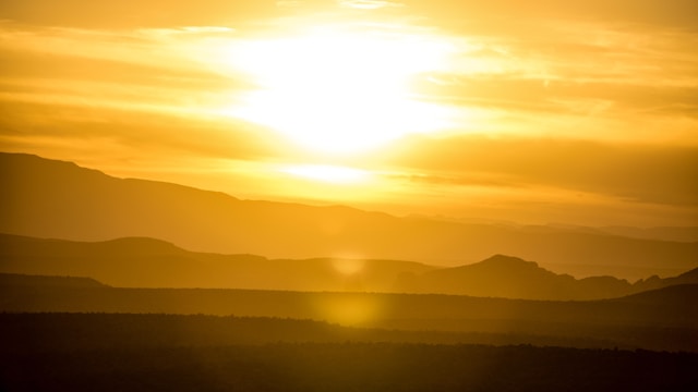 A close-up of a sunset on the horizon