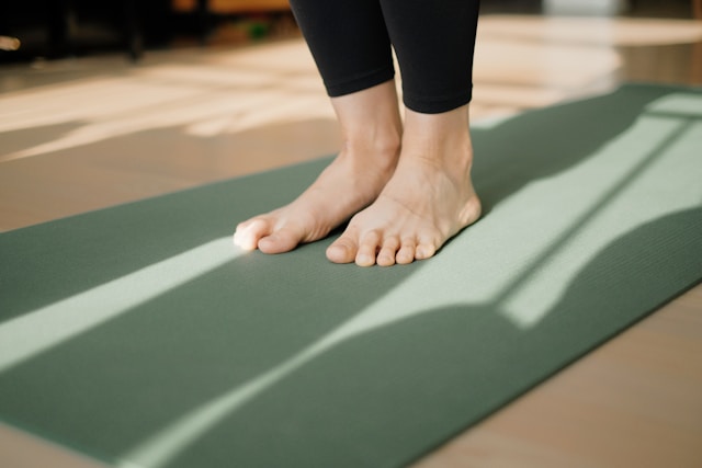 A person gently stretching at home